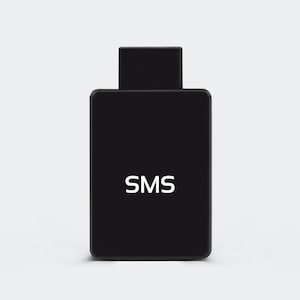 May include: A black rectangular device with a smaller, rectangular top. The white letters "SMS" are centered on the front. The device is set against a plain, light background.