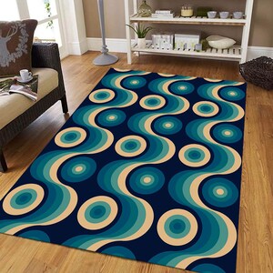 Peut inclure: Un tapis bleu et beige avec un motif géométrique de cercles concentriques et de lignes ondulées.