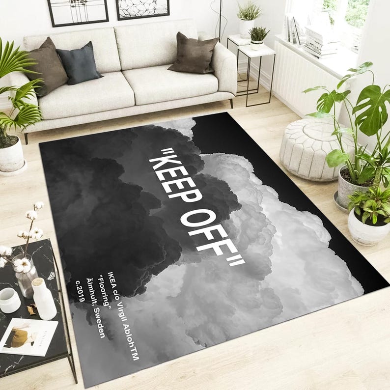 May include: Black and white rug with a cloud design and the text "KEEP OFF" printed in white. The rug is designed by IKEA c/o Virgil AblohTM.