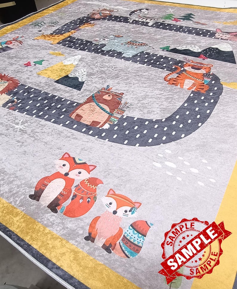 May include: A gray and yellow rug with a whimsical design featuring various animals, including foxes, bears, tigers, and zebras. The animals are depicted in a cartoon style and are surrounded by a black and white dotted path. The rug has a yellow border and a white border.