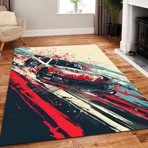 May include: A rectangular area rug featuring a dynamic, abstract illustration of a red and black stock car racing on a track. The design incorporates bold, energetic paint splatters and motion streaks in shades of red, black, white, and teal.