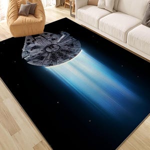 May include: Rectangular rug with a detailed image of a spaceship against a black space backdrop and a blue light trail. The rug's design is inspired by a science fiction film.