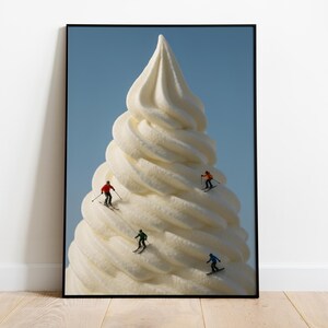 May include: A framed art print featuring a whimsical scene of miniature skiers descending a giant soft-serve ice cream cone against a clear blue sky. The ice cream is a creamy white color, and the skiers wear colorful outfits.