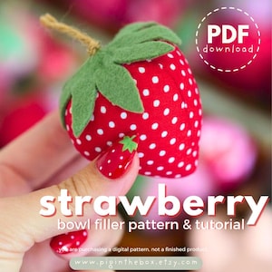 May include: A handmade strawberry bowl filler with a green felt top and white polka dots on a red fabric. The image includes the text "strawberry bowl filler pattern & tutorial" and "PDF download".