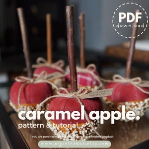 May include: A set of fabric caramel apple ornaments featuring red linen fabric, brown twig stems, and tan twine bows. The base of each apple is decorated with small white beads. Text on the image reads: PDF download, caramel apple, pattern & tutorial.