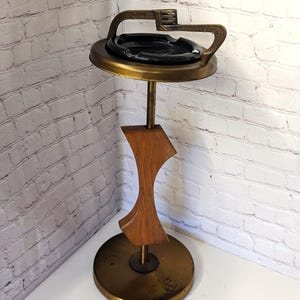 Mid Century Modern standing ashtray. Rare Brass and Wood finish made in 60&#39;s  . Vintage, simple and elegant. Very good condition as shown.