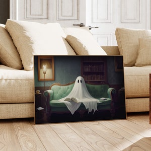 May include: A white ghost sitting on a green velvet sofa reading a book in a dimly lit room with a bookcase in the background.