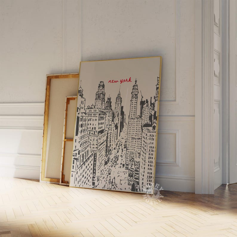 May include: Black and white illustration of a cityscape with the text "new york" in red. The illustration is on a canvas with a gold frame.