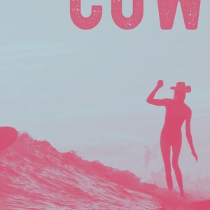 May include: A silhouette of a person wearing a cowboy hat and standing on a surfboard in a pink wave. The word "COW" is written in pink at the top of the image.