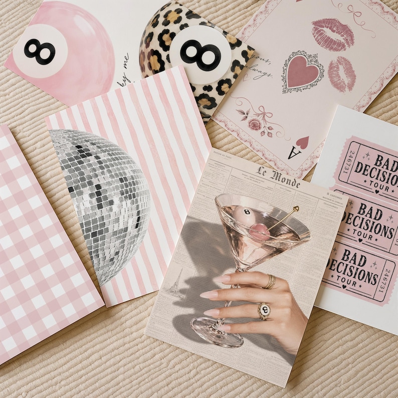 May include: A collection of six rectangular art prints featuring diverse designs including a pink billiard ball, a leopard print eight ball, a playing card with lips, a disco ball on pink stripes, a martini glass, and pink Bad Decisions Tour tickets.