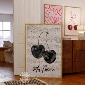 May include: A black and white watercolor print of two cherries with the text "Ma Ch&eacute;rie" on a white background with black script.