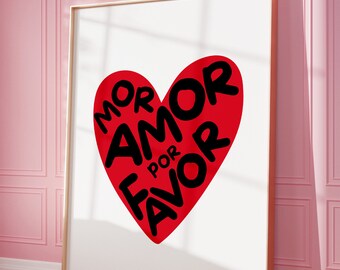 May include: A red heart with the words "MOR AMOR POR FAVOR" written in black inside of it. The heart is on a white background.