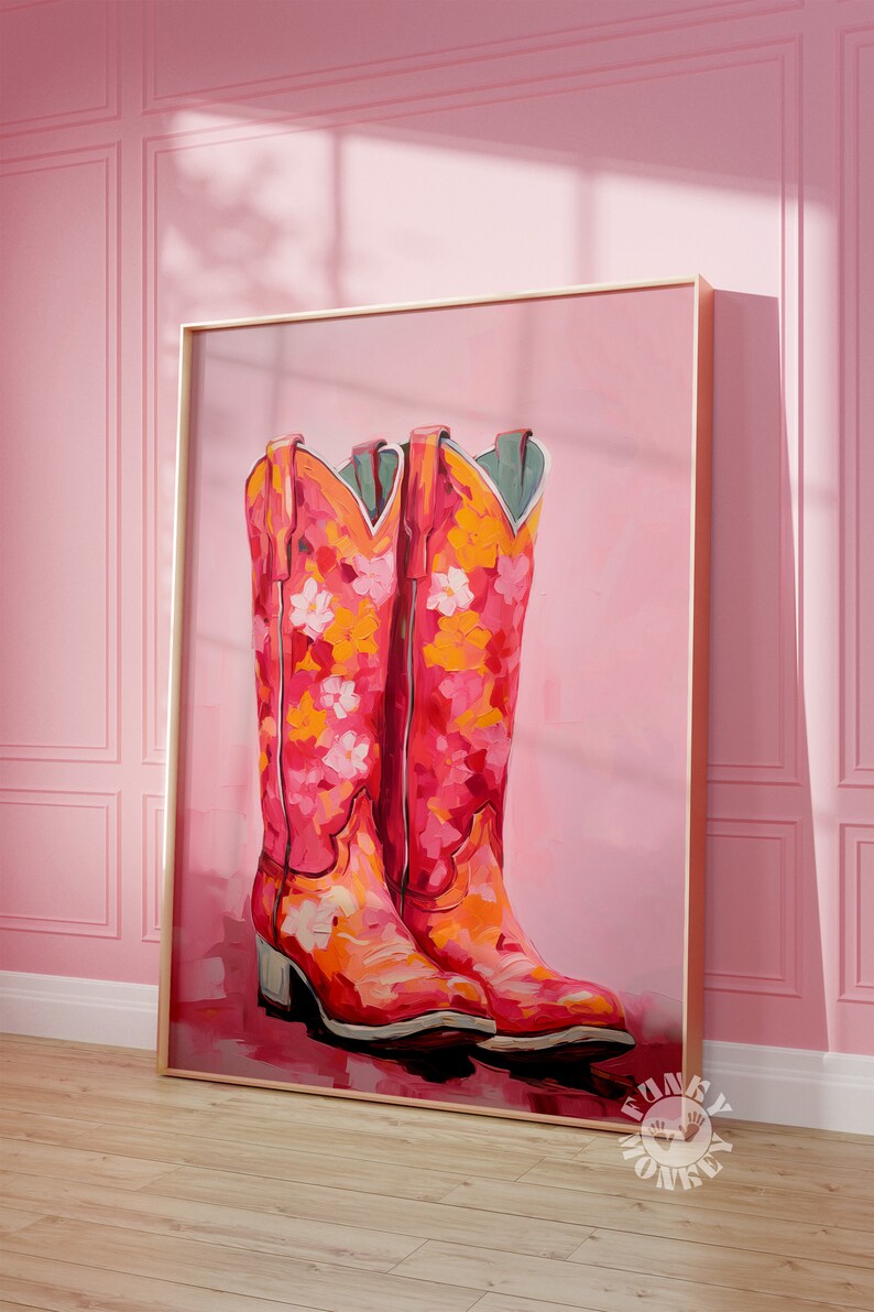 May include: A painting of a pair of pink cowboy boots with floral designs on a pink background.