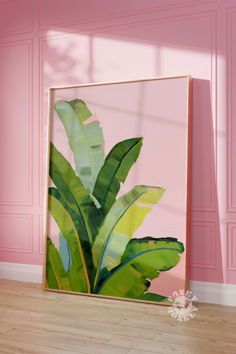 May include: A framed painting of green banana leaves against a pink background. The leaves are painted in a loose, impressionistic style.