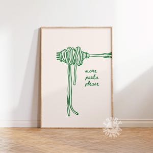 Peut inclure: Un dessin au trait vert d'une fourchette avec des spaghettis enroul&eacute;s autour. Le texte "more pasta please" est &eacute;crit sous les spaghettis.