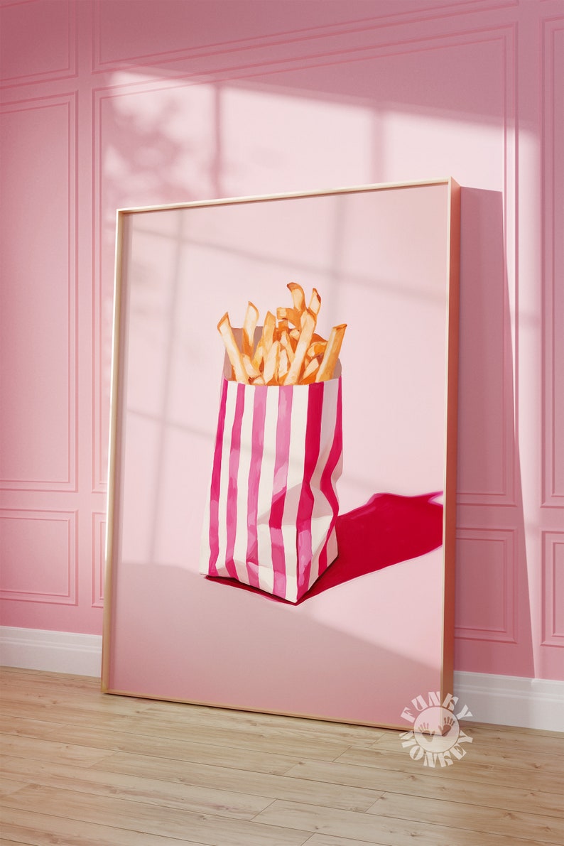 May include: A pink and white striped paper bag filled with golden french fries. The bag is sitting on a pink background with a shadow.