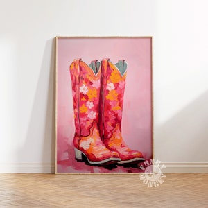 May include: A painting of a pair of pink cowboy boots with floral patterns on a pink background.