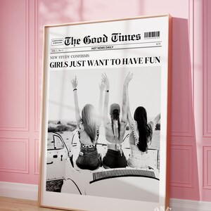 May include: Black and white photo of three women in a convertible car with their arms raised in the air. The photo is printed on a newspaper with the headline "The Good Times" and the text "NEW STUDY CONFIRMS: GIRLS JUST WANT TO HAVE FUN".