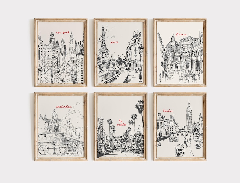May include: Set of six black and white framed prints featuring hand-drawn illustrations of famous landmarks in cities around the world. The prints include New York, Paris, Florence, Amsterdam, Los Angeles, and London.