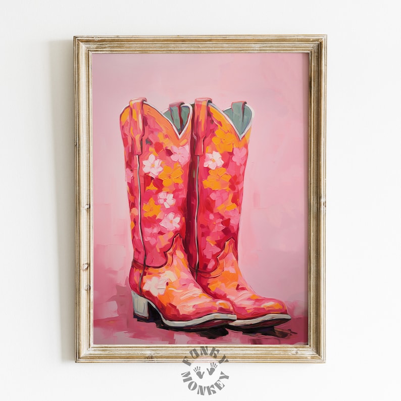 May include: A painting depicting a pair of pink cowboy boots with floral designs. The boots are set against a pale pink background.