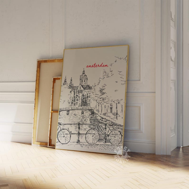 May include: A black and white illustration of a canal in Amsterdam with a building in the background and bicycles on the bridge. The word "amsterdam" is written in red above the building.