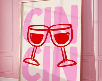 Puede incluir: Un póster rosa y blanco con la palabra "GIN CIN" en letras rosas grandes. Dos copas de vino tinto chocan en el centro del póster.