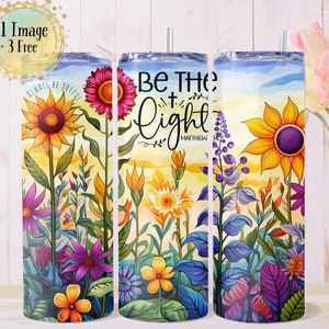 May include: Three stainless steel tumblers with colorful floral designs and inspirational quotes. The first tumbler features a sunflower and the words "Always Be Joyful". The second tumbler features a sunflower and the words "Be The Light Matthew 5:14". The third tumbler features a sunflower and a blue sky background.