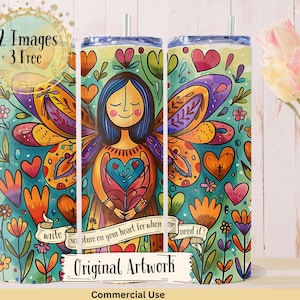 May include: A colorful tumbler with a whimsical illustration of an angel with wings made of flowers and hearts. The text "write sa ofure on your heart for when ou need it" is written on the tumbler. The tumbler is surrounded by a green and blue background with flowers and hearts.