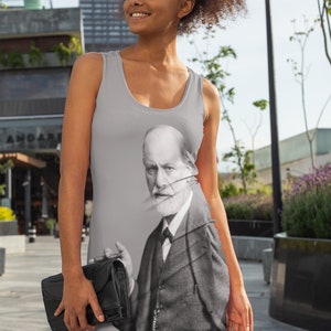 May include: A gray tank dress with a black and white image of Sigmund Freud printed on the front. The image shows Freud in a suit and tie, holding a cigar in his right hand.