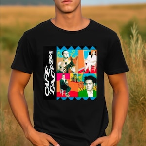 May include: Black t-shirt featuring a colourful graphic of the band Cafe Tacvba. The graphic depicts four band members in various poses and a dog.