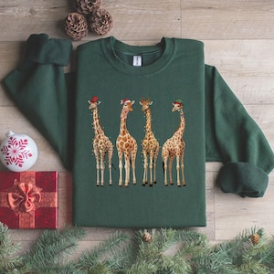 キリンのクリスマス スウェットシャツ、キリンのクリスマス ライト スウェットシャツ、キリン好きの方へのギフト、キリンのクリスマス セーター、キリンのホリデー シャツ
