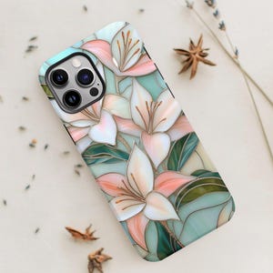 Stargazer lily stained glass phone case with blush pink flowers, green leaves, and teal faux glass background, printed flat with a 3D look.