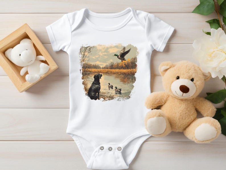 Retro duck hunting baby bodysuit featuring a black lab and mallard ducks by a pond, printed outdoors scene for babies, kids, and adults, perfect for hunting families and dog lovers.