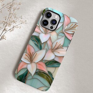 Stargazer lily stained glass phone case with blush pink flowers, green leaves, and teal faux glass background, printed flat with a 3D look.