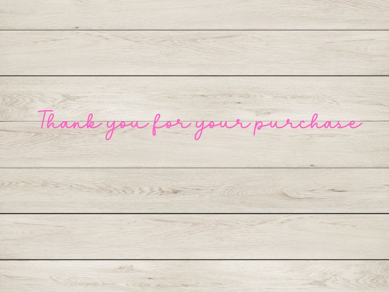 May include: Thank you for your purchase written in pink cursive on a light wood background.