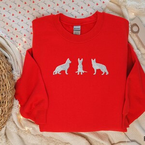 Embroidered German Shepherd Sweatshirt that features 3 embroidered German Shepherds.
