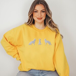 Embroidered German Shepherd Sweatshirt that features 3 embroidered German Shepherds.