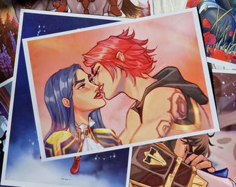 May include: A digital illustration of two people embracing. The person on the left has blue hair and is wearing a gold and white outfit. The person on the right has red hair and is wearing a black and gold outfit. The background is a sunset with a pink and orange sky.