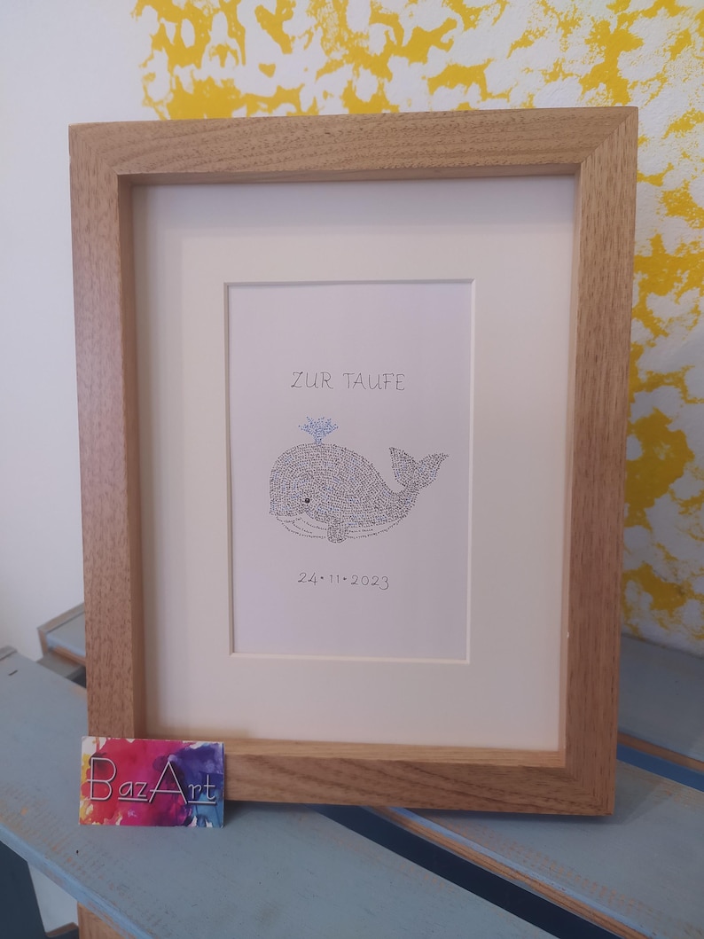 Front view of an image of a baby whale. The complete image consists entirely of handwritten words. In this image the words are hundreds of times the name of the newborn baby.
Under the baby whale is written the date of the baptism.