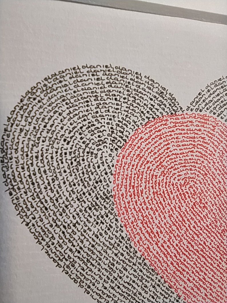 May include: A heart-shaped illustration composed of repeated handwritten text. The left side features the name Daniel written in black ink, while the right side features the name Nadine written in red ink, both following the heart's curved outline.