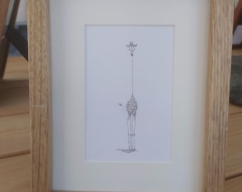 May include: A framed black and white line drawing of a giraffe with a long neck and long legs. The drawing is on white paper and is framed in a light brown wooden frame.