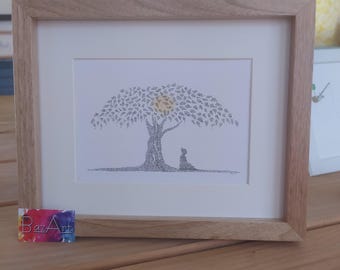 May include: A framed print featuring a black and white ink drawing of a tree with a yellow sun behind its canopy and a small figure sitting at its base. The artwork is enclosed in a light-colored wooden frame with a white mat border.