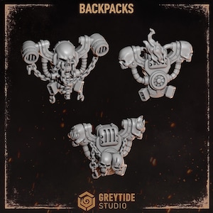 May include: Three grey miniature backpacks for gaming figures, each featuring distinct skull and chain motifs. The top left piece has a central skull with chains, the top right has flames and side skulls, and the bottom piece features dual skulls.