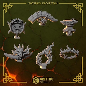 May include: A collection of gray backpack decorations, including an anvil, a dragon head, and a flame design. The text "BACKPACK DECORATION" is at the top. The GreyTide Studio logo is at the bottom.