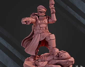 May include: A pink plastic miniature figurine of a soldier wearing a long coat and a hat, holding a gun and standing over a fallen soldier. The soldier is standing on a rocky base.