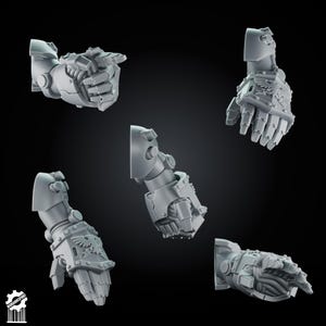 May include: Five grey miniature robotic arms with armored gauntlets, featuring articulated fingers and an eagle emblem on the back of the hand. One arm is pointing, while the others are in various positions. The logo Wargamesprint is in the corner.