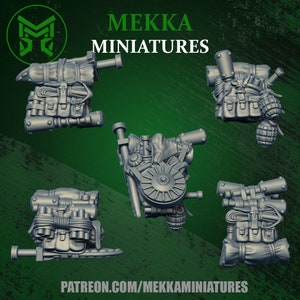 May include: Five 3D printed miniature backpacks with various straps, buckles, and pouches. The backpacks are gray and have a detailed design. The text "MEKKAMINIAUTRES" is visible at the top of the image.