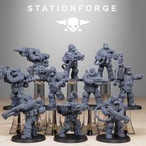 May include: A set of nine gray plastic miniature figures of soldiers, each holding a weapon. The figures are standing on clear plastic bases. The figures are all wearing helmets and gas masks. The figures are all wearing armor and carrying weapons. The figures are all standing in a line. The figures are all facing forward. The figures are all in a fighting stance. The figures are all ready for battle. The figures are all part of a war game.