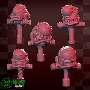 May include: Five 3D printed miniature figures of a grotesque, one-eyed creature with a toothy grin. Each figure is mounted on a short, cylindrical base with a cross-shaped bar.