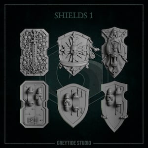 May include: Six different shield designs, all in a gray color. The shields are all different shapes and sizes, and they all have different details. The shields are labeled "SHIELDS 1" and "GREYTIDE STUDIO".